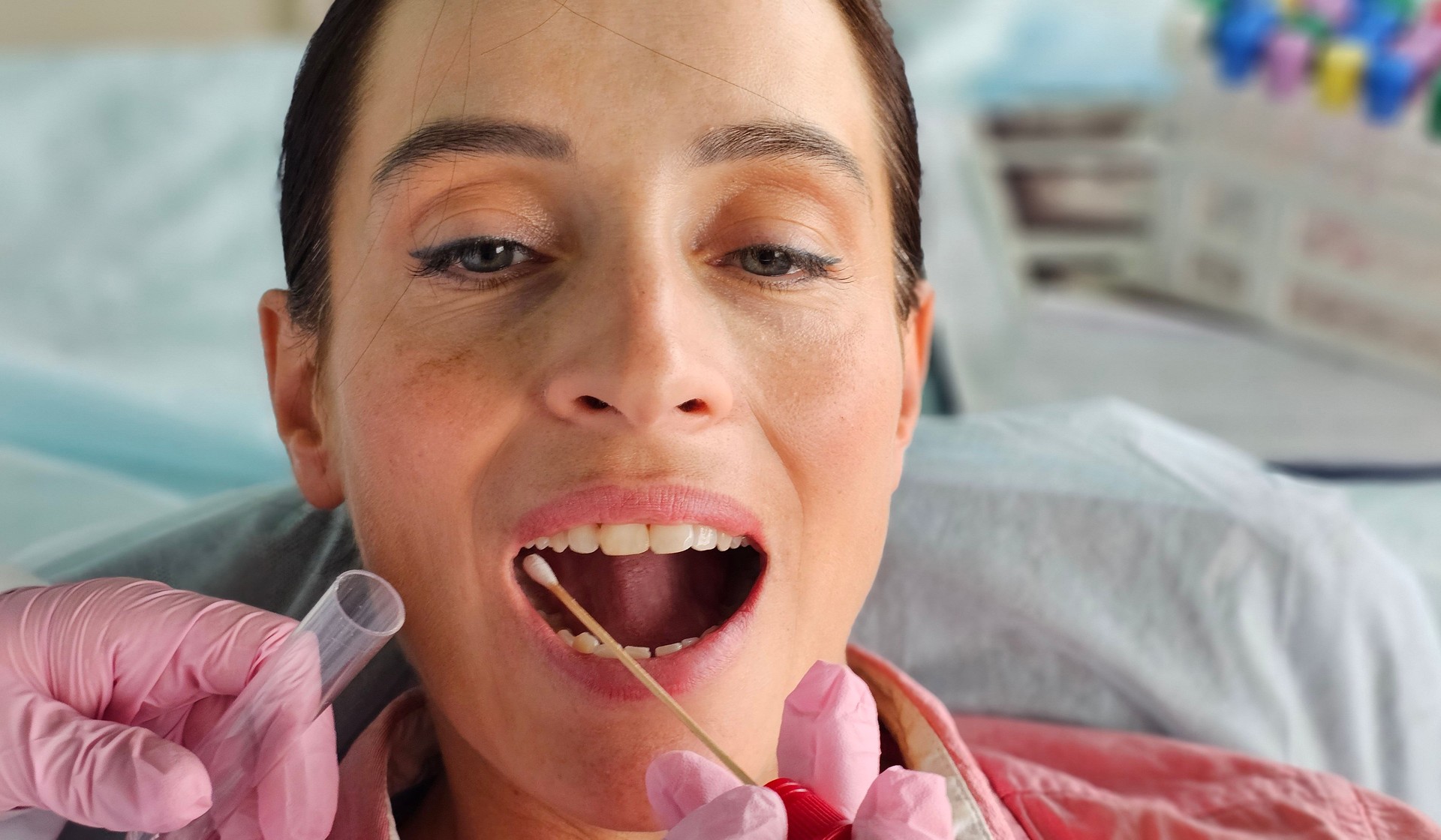 Taking a mouth swab for DNA analysis closeup